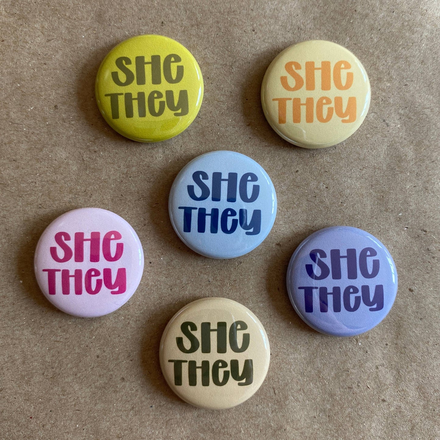 Pronoun pin back button