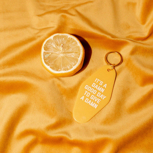 Give A Damn Goldenrod Motel Keytag