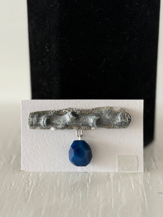 Leigh Roberts: Gesso & Graphite powder cottonwood stem brooch on fused sterling with blue agate