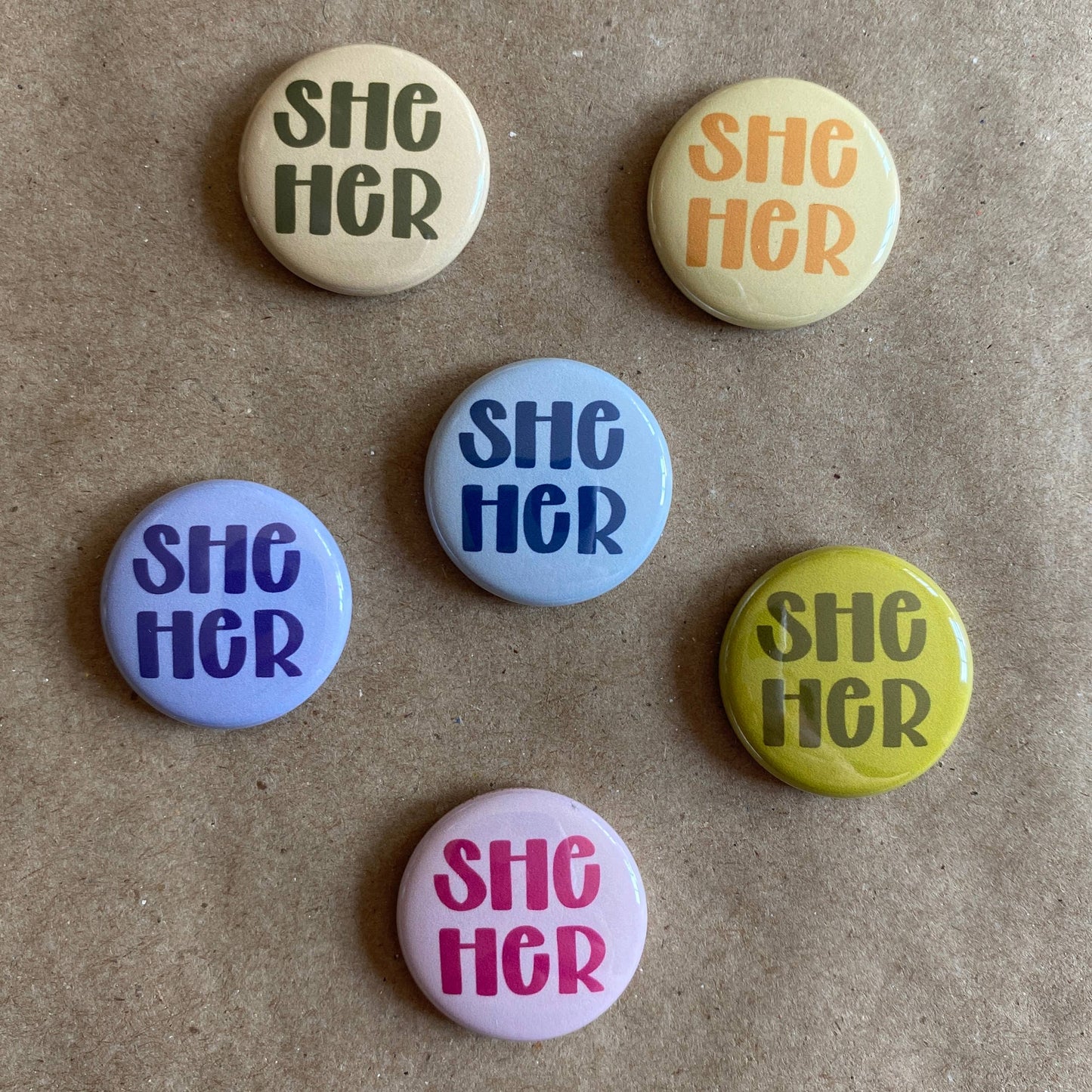 Pronoun pin back button